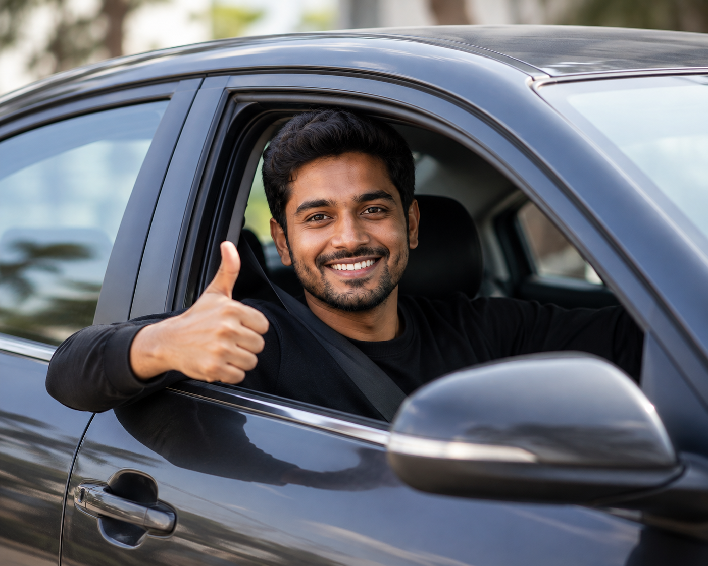 Driver giving a thumbs up from a car window