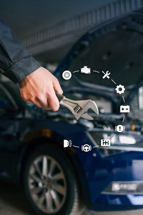 Technician's hand tightening a bolt with a wrench under a car's open hood
