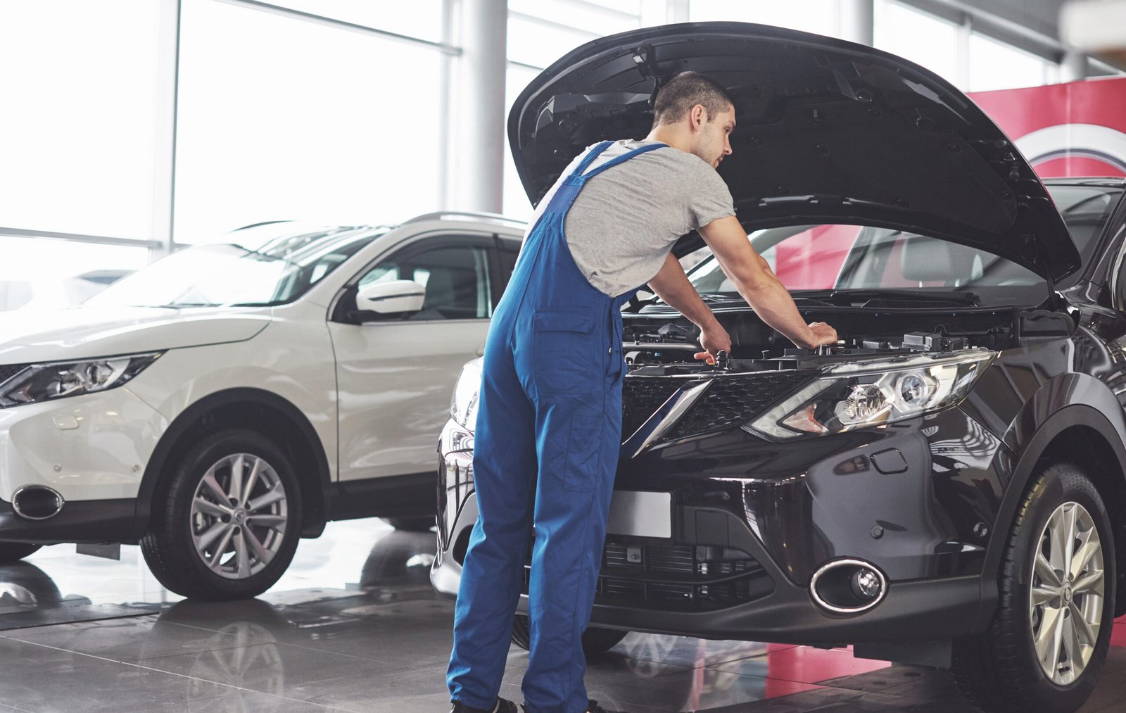 Technician servicing a vehicle